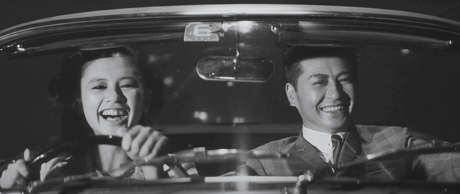 Saeko and Muraki driving